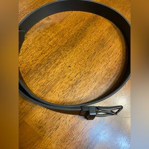 Faux leather belt.  Size 40–44.